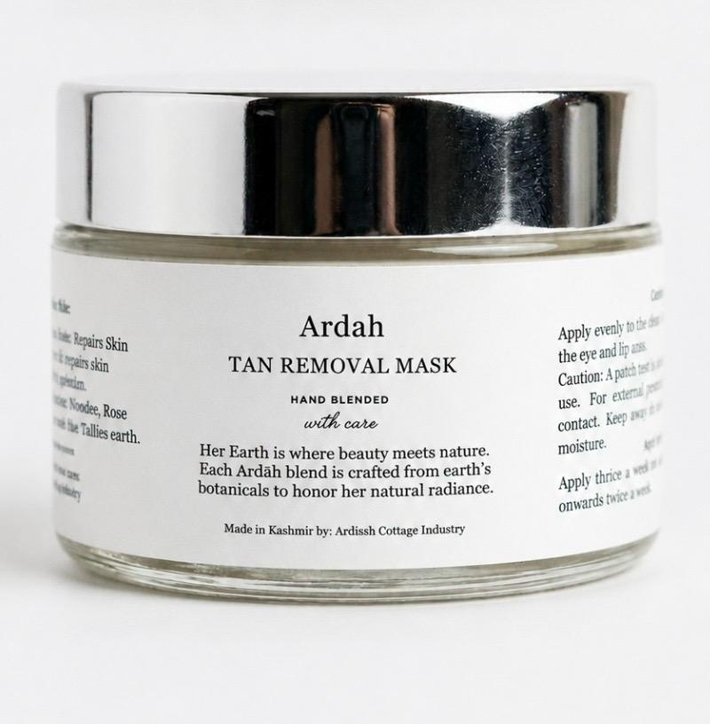 A clear glass jar of Ardah Tan Removal Mask with a reflective silver lid and a white label, set against a plain white background.