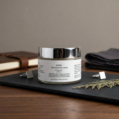 Ardah dehydrating mask jar on a dark surface with a blurred background