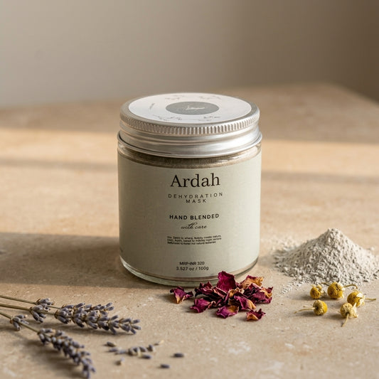 Ardah dehydrating mask jar on a neutral background with dried flowers and lavender.
